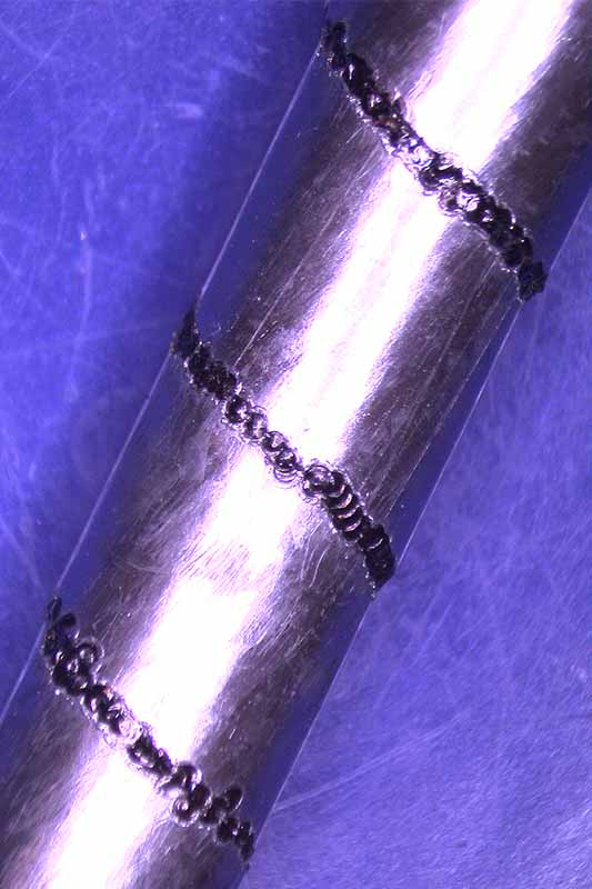 Pulsed laser weld on steel strip